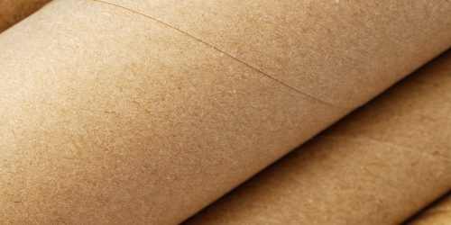 Background with surface of recycled cardboard tubes
